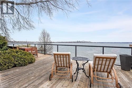 Wooden terrace with a water view - 624 North Shore Boulevard E, Burlington, ON - Outdoor With Body Of Water With Deck Patio Veranda