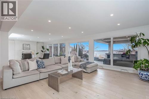 Living area with light wood-style floors, recessed lighting, and a water view - 624 North Shore Boulevard E, Burlington, ON - Indoor Photo Showing Living Room