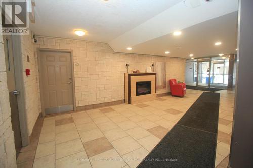 305 - 155 Kent Street, London East (East F), ON - Indoor Photo Showing Other Room With Fireplace