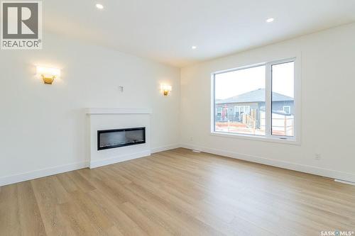 150 Mazurek Crescent, Saskatoon, SK - Indoor Photo Showing Living Room With Fireplace