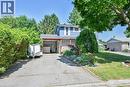 Traditional-style house with a front yard, driveway, and a carport - 56 Forsythe Avenue, Brantford, ON  - Outdoor 