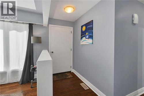 Foyer with baseboards and dark wood-type flooring - 56 Forsythe Avenue, Brantford, ON - Indoor Photo Showing Other Room