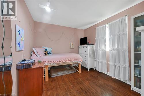 Bedroom featuring dark wood finished floors and ceiling fan - 56 Forsythe Avenue, Brantford, ON - Indoor Photo Showing Bedroom