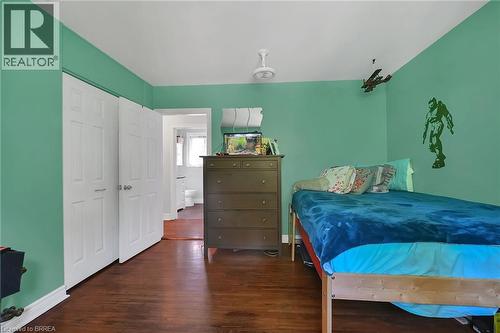 Bedroom featuring dark wood-style flooring and baseboards - 56 Forsythe Avenue, Brantford, ON - Indoor Photo Showing Bedroom