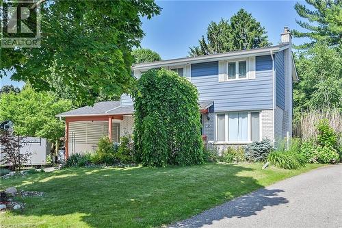 View of front of property featuring brick siding, a front lawn, and a chimney - 56 Forsythe Avenue, Brantford, ON - Outdoor