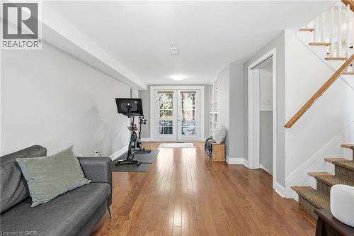 Workout area featuring wood-type flooring and french doors - 227 Walden Drive, Burlington, ON - Indoor