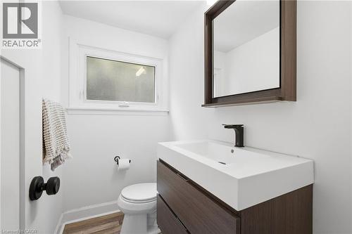 Half bath featuring vanity and light wood-style flooring - 227 Walden Drive, Burlington, ON - Indoor Photo Showing Bathroom