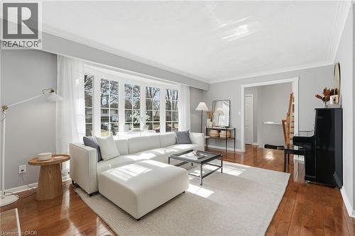 Living area featuring hardwood / wood-style flooring and ornamental molding - 227 Walden Drive, Burlington, ON - Indoor Photo Showing Living Room