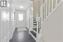 Foyer entrance with stairs and dark tile patterned flooring - 440 Langlaw Drive, Cambridge, ON  - Indoor Photo Showing Other Room 
