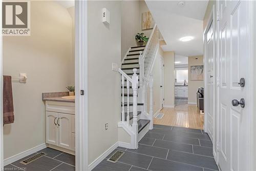 Foyer entrance featuring dark tile patterned floors - 440 Langlaw Drive, Cambridge, ON - Indoor Photo Showing Other Room