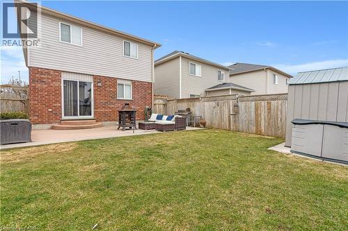 Back of property featuring an outdoor lounge area, a patio area, a storage shed, and a fenced backyard - 440 Langlaw Drive, Cambridge, ON - Outdoor With Deck Patio Veranda With Exterior