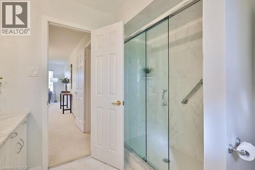 Bathroom featuring a marble finish shower, light marble finish flooring, and vanity - 700 Fieldstone Road, Mississauga, ON - Indoor Photo Showing Bathroom