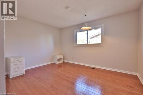 Spare room with light wood finished floors and a textured ceiling - 700 Fieldstone Road, Mississauga, ON - Indoor Photo Showing Other Room