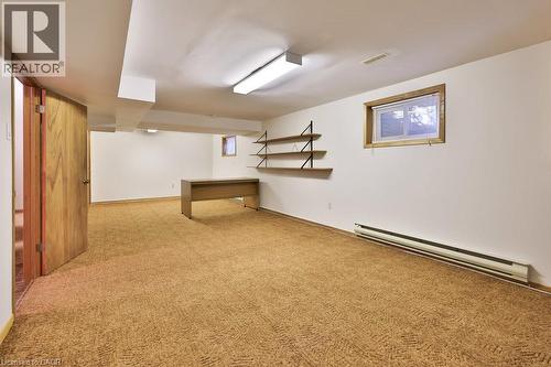 Finished basement featuring baseboard heating and light carpet - 700 Fieldstone Road, Mississauga, ON - Indoor