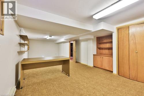 Unfurnished office with light colored carpet and a baseboard heating unit - 700 Fieldstone Road, Mississauga, ON - Indoor Photo Showing Other Room