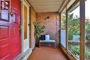 Sunroom / solarium featuring brick wall and carpet floors - 700 Fieldstone Road, Mississauga, ON  -  With Exterior 