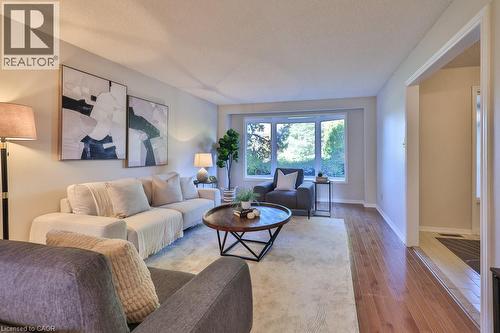 Living area featuring hardwood / wood-style flooring and a textured ceiling - 700 Fieldstone Road, Mississauga, ON - Indoor Photo Showing Living Room