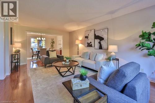 Living area with wood-type flooring and hanging lights - 700 Fieldstone Road, Mississauga, ON - Indoor Photo Showing Living Room