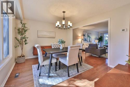 Dining room featuring wood finished floors and hanging lights - 700 Fieldstone Road, Mississauga, ON - Indoor Photo Showing Dining Room
