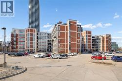View of property with uncovered parking - 