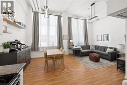 Living area featuring light wood-style floors and healthy amount of natural light - 