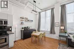 Dining room with baseboards and light wood finished floors - 