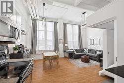 Living area featuring light wood-style floors - 