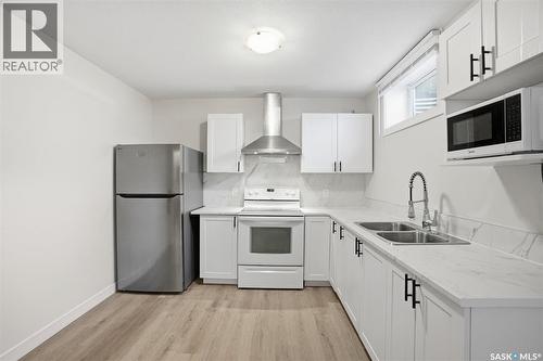 505 L Avenue N, Saskatoon, SK - Indoor Photo Showing Kitchen With Double Sink
