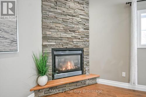 111 Balm Beach Road E, Tiny, ON - Indoor Photo Showing Living Room With Fireplace