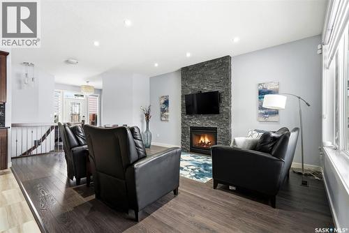 3921 Red Lily Bay, Regina, SK - Indoor Photo Showing Living Room With Fireplace