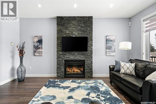 3921 Red Lily Bay, Regina, SK - Indoor Photo Showing Living Room With Fireplace