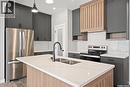 313 Veterans Drive, Warman, SK  - Indoor Photo Showing Kitchen With Double Sink With Upgraded Kitchen 