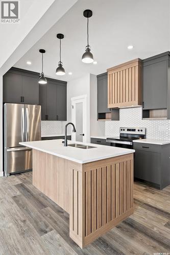 313 Veterans Drive, Warman, SK - Indoor Photo Showing Kitchen With Upgraded Kitchen
