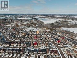 Snowy aerial view featuring a residential view - 