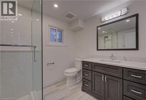 Bathroom with a stall shower, vanity, and recessed lighting - 383 Rexford Drive Unit# 2, Hamilton, ON - Indoor Photo Showing Bathroom