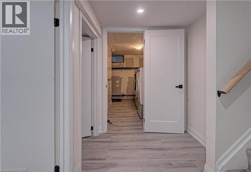 Corridor featuring light wood-style flooring and recessed lighting - 383 Rexford Drive Unit# 2, Hamilton, ON - Indoor Photo Showing Other Room