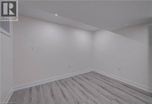 Finished basement with light wood finished floors and baseboards - 383 Rexford Drive Unit# 2, Hamilton, ON - Indoor Photo Showing Other Room