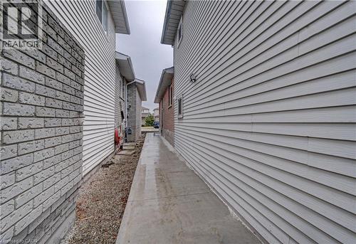 concrete walkway to back entry - 383 Rexford Drive Unit# 2, Hamilton, ON - Outdoor