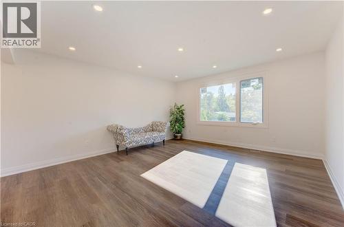Living area featuring recessed lighting and wood finished floors - 90 Culpepper Drive, Waterloo, ON - Indoor Photo Showing Other Room