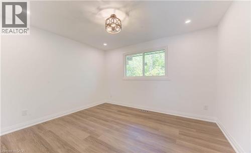 Unfurnished room featuring light wood-type flooring and recessed lighting - 90 Culpepper Drive, Waterloo, ON - Indoor Photo Showing Other Room