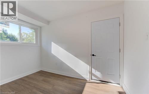 Unfurnished room with light wood-style flooring and baseboards - 90 Culpepper Drive, Waterloo, ON - Indoor Photo Showing Other Room