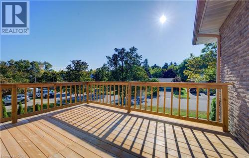Wooden terrace featuring view of scattered trees - 90 Culpepper Drive, Waterloo, ON - Outdoor With Deck Patio Veranda