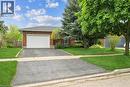 View of front facade featuring driveway, brick siding, and an attached garage - 47 Claycroft Crescent Unit# Upper, Kitchener, ON  - Outdoor 