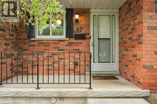 Entrance to property with brick siding and covered porch - 47 Claycroft Crescent Unit# Upper, Kitchener, ON - Outdoor With Exterior