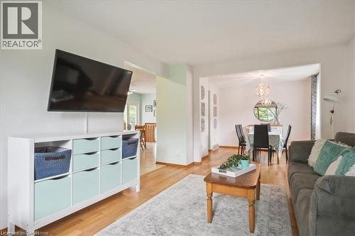 Living room with light wood-style flooring and a chandelier - 47 Claycroft Crescent Unit# Upper, Kitchener, ON - Indoor Photo Showing Living Room
