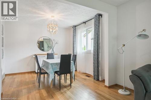 Dining space featuring light wood-style flooring and suspended lighting - 47 Claycroft Crescent Unit# Upper, Kitchener, ON - Indoor Photo Showing Dining Room