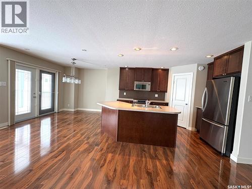 29 500 Battleford Trail, Swift Current, SK - Indoor Photo Showing Kitchen With Double Sink