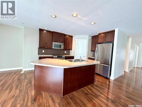 29 500 Battleford Trail, Swift Current, SK - Indoor Photo Showing Kitchen With Double Sink
