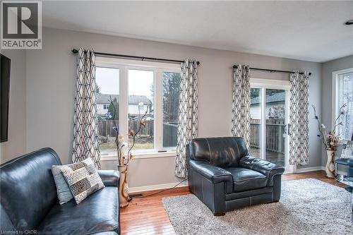 Sitting room with wood-type flooring and baseboards - 236 Dartmoor Crescent, Waterloo, ON - Indoor Photo Showing Living Room