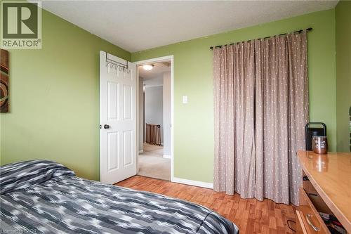 Bedroom featuring a textured ceiling and light wood-type flooring - 236 Dartmoor Crescent, Waterloo, ON - Indoor Photo Showing Bedroom